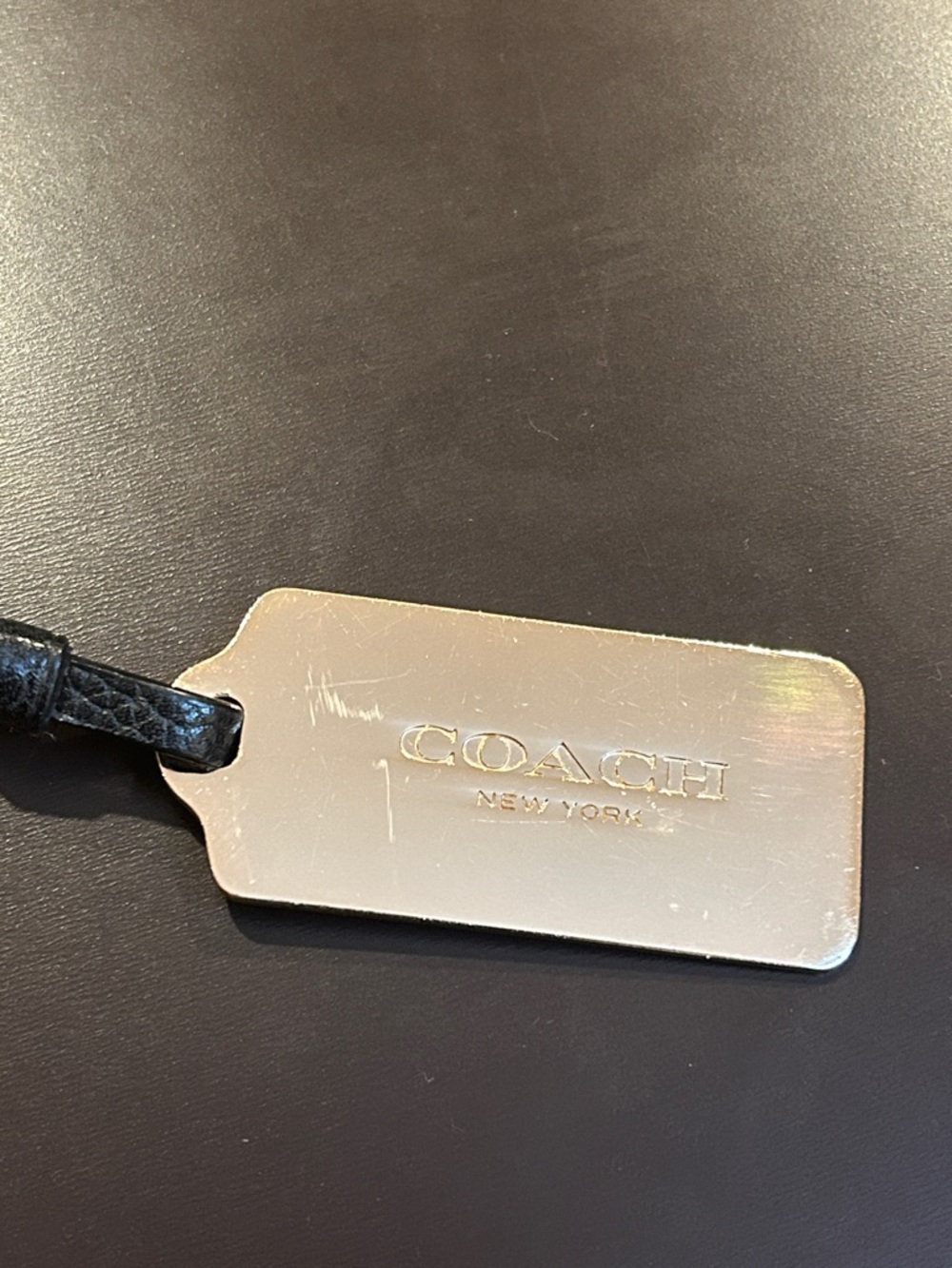 Coach Gold-tone Logo Tag with Black Leather Strap